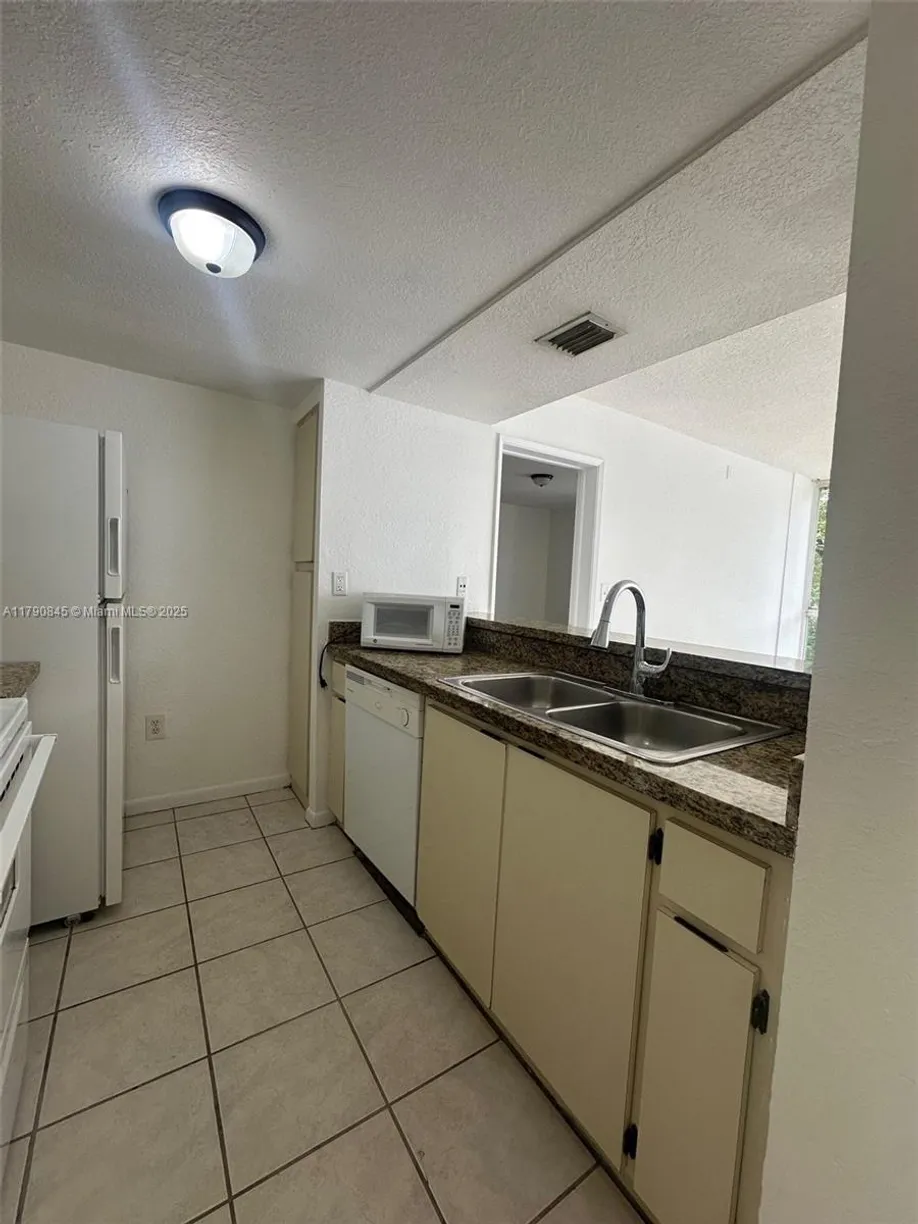South Florida Real Estate | View 7125 NW 186th St, B208 | Listing