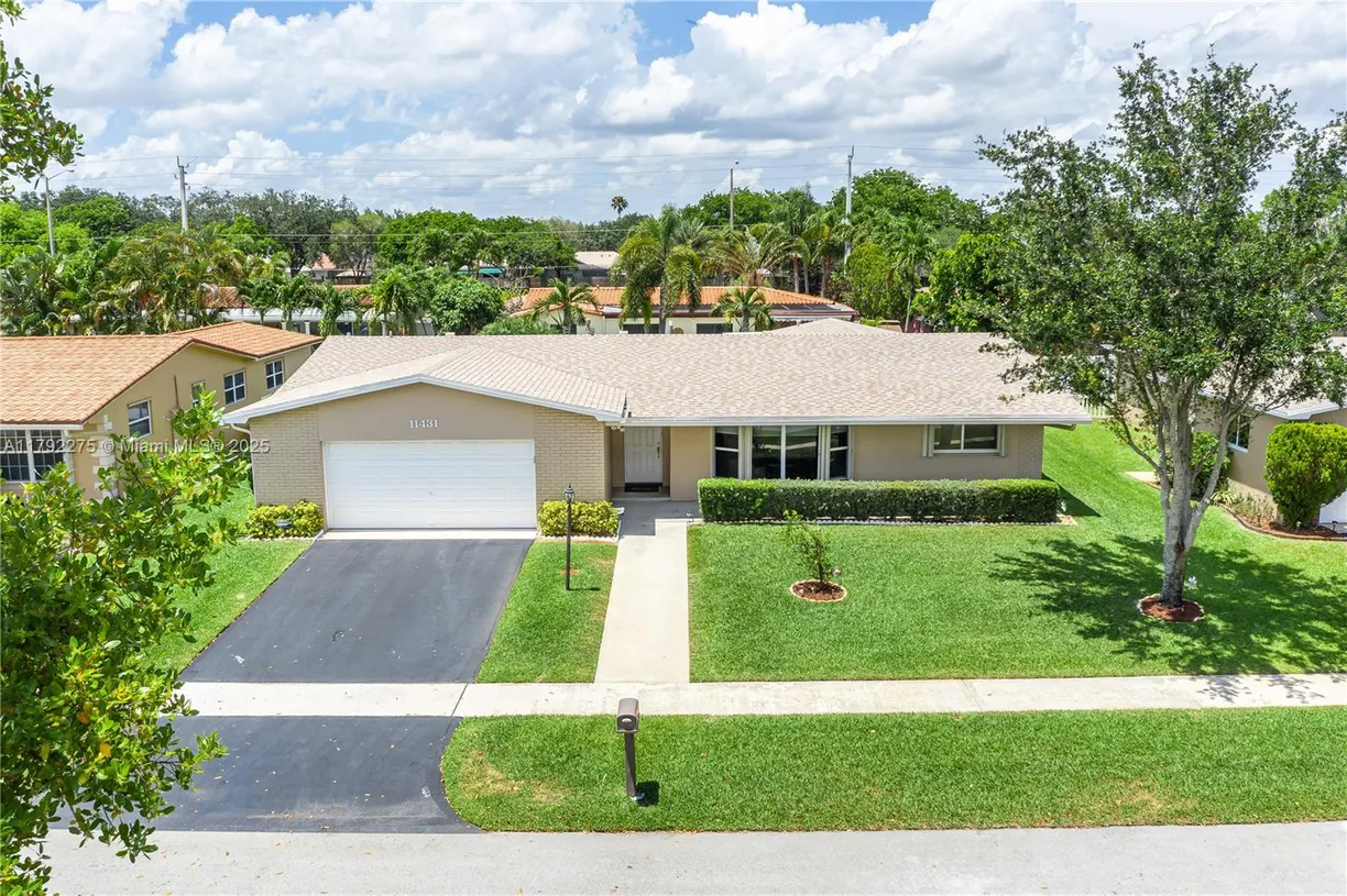 South Florida Real Estate | View 11431 NW 23rd St | 4 Beds, 2 Baths