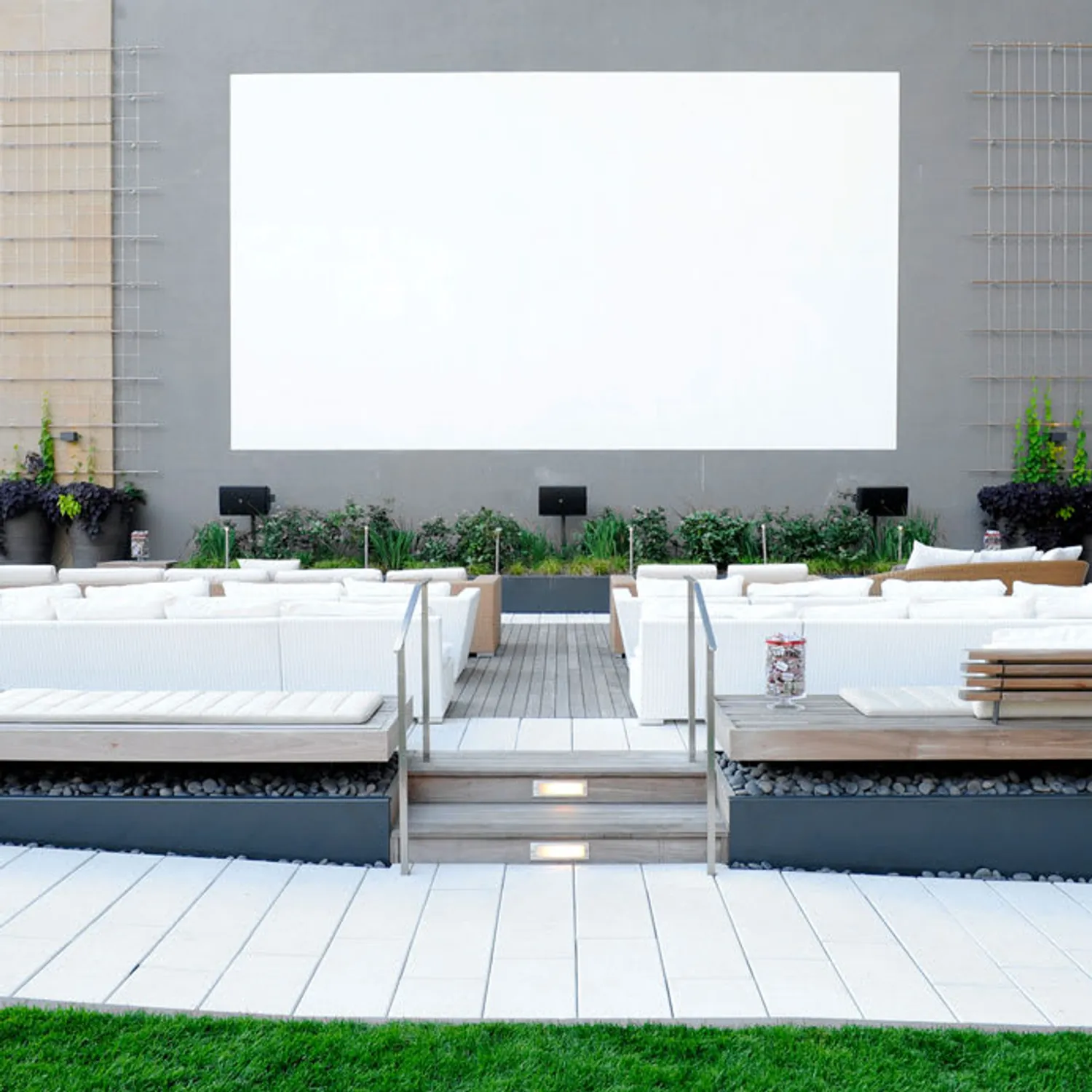 Sun-drenched south law with outdoor cinema.