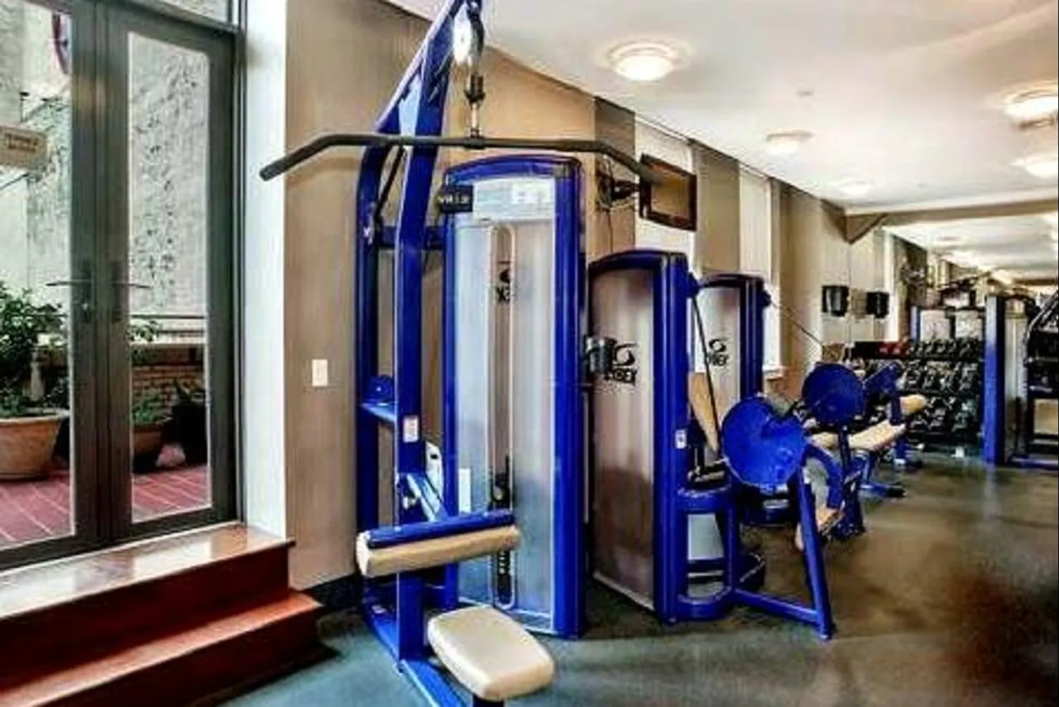 Fully-equipped gym with adjacent terrace