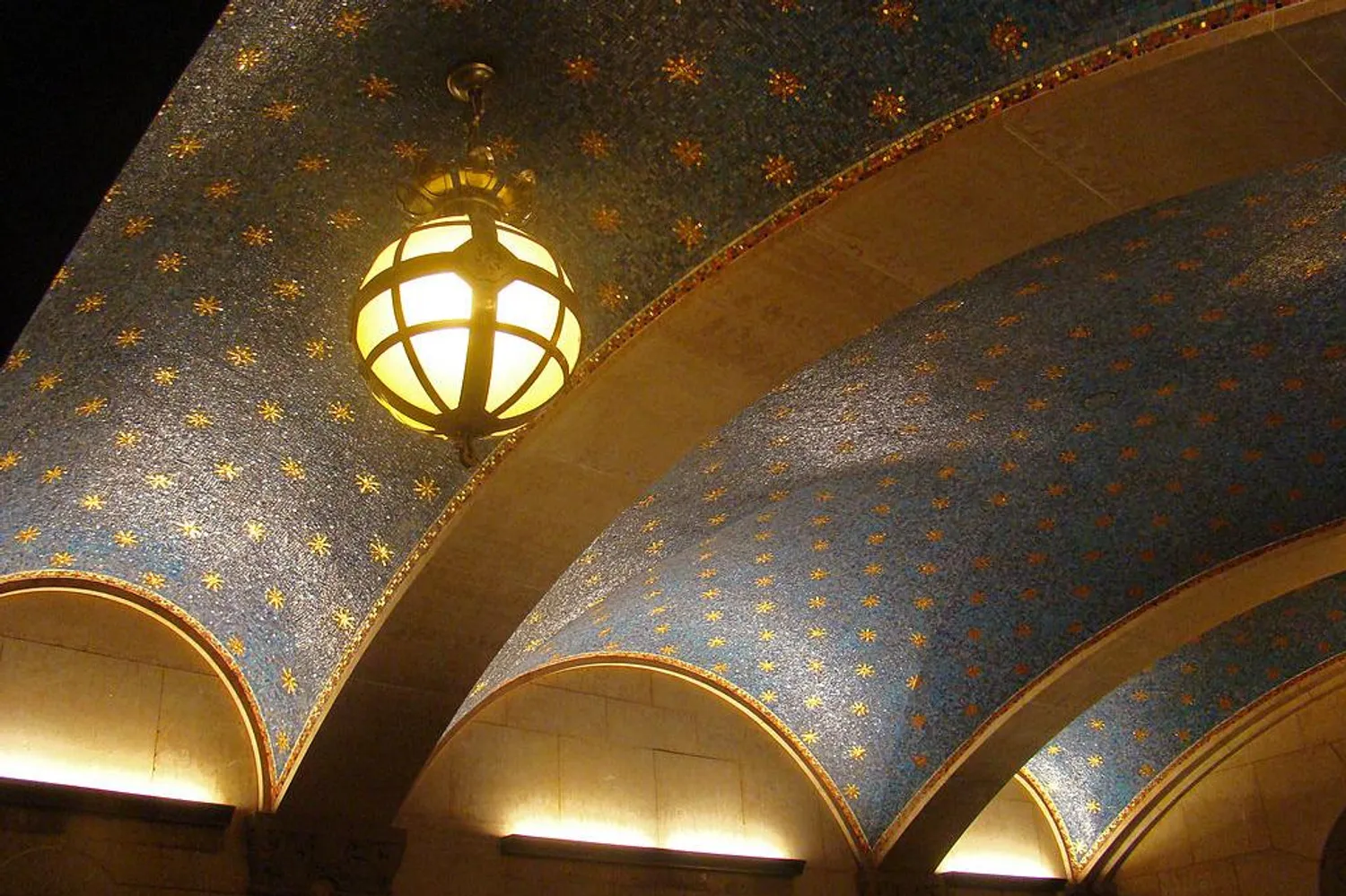 Gold and cobalt mosaic lobby ceiling