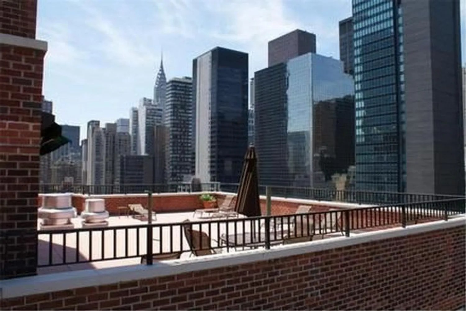 Roofdeck w/ lounge chairs - views of Chrysler Bldg