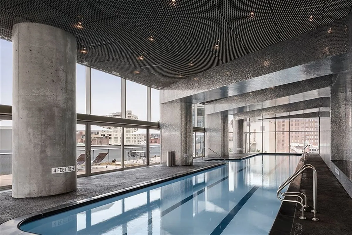 Shimmering 75-foot lap pool and hot tub