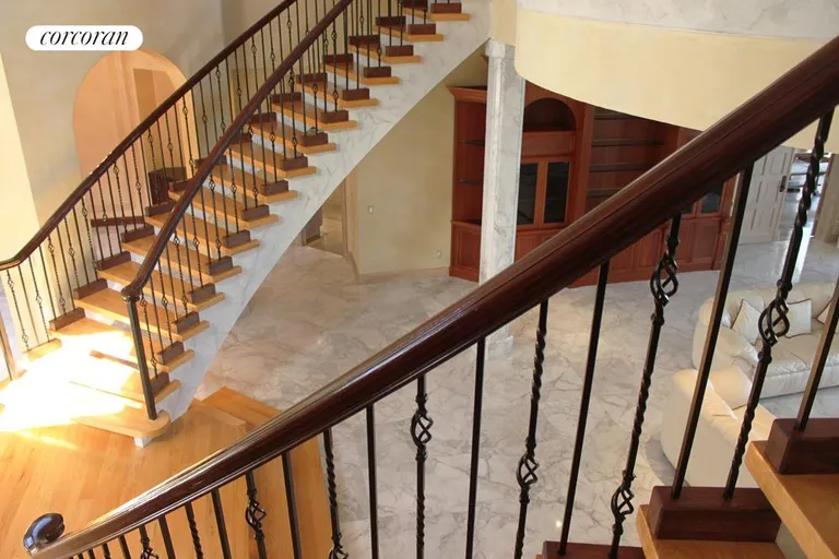 New York City Real Estate | View 3435 North Ocean Boulevard | Dramatic double staircase entrance | View 5