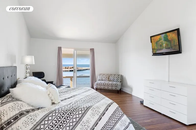 New York City Real Estate | View  | UPPER MASTER BEDROOM WITH WATERSIDE DECK | View 9