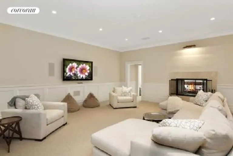 New York City Real Estate | View  | Lower Level Media Room with double sided Fireplace | View 18