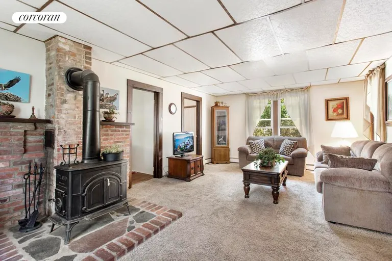 New York City Real Estate | View  | Living Room with Woodburning Stove | View 6