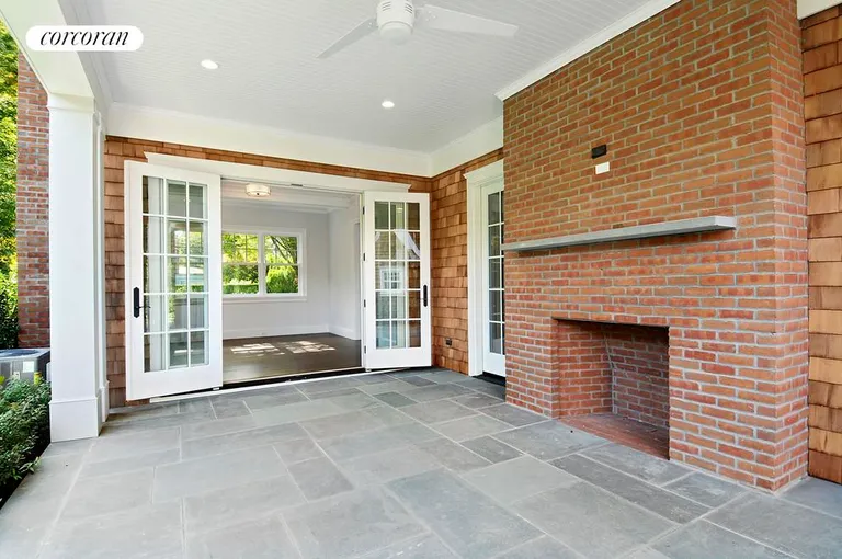 New York City Real Estate | View  | Alternate view of covered porch with outdoor fireplace | View 16
