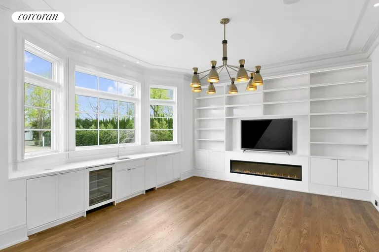 New York City Real Estate | View  | Gas fireplace and wetbar in the library | View 6