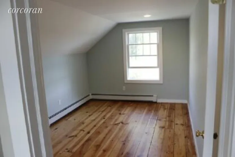 New York City Real Estate | View 4735 Cox Ln | Roomy Spare Bedroom w/Original Wood Flooring | View 8