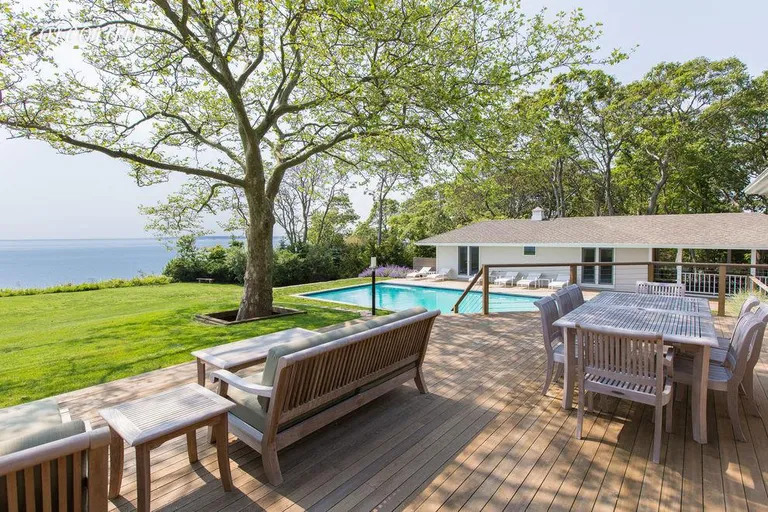 New York City Real Estate | View 183 Ram Island Drive | Deck overlooking Pool And Water Front | View 2