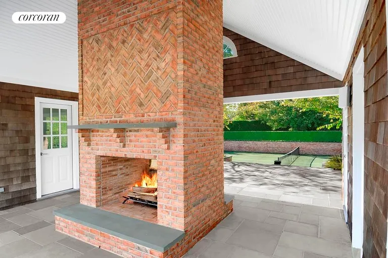 New York City Real Estate | View  | Pool House/Tennis Pavilion with Double-Sided Fireplace | View 6