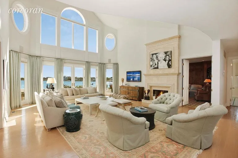New York City Real Estate | View 36 Westbridge Road | Living room with fantastic water views and firepla | View 3