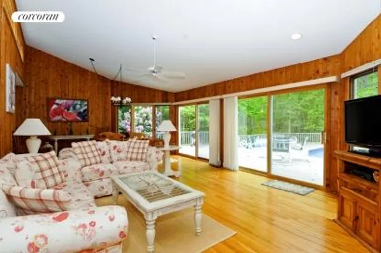 New York City Real Estate | View  | living room opening to deck and pool | View 2