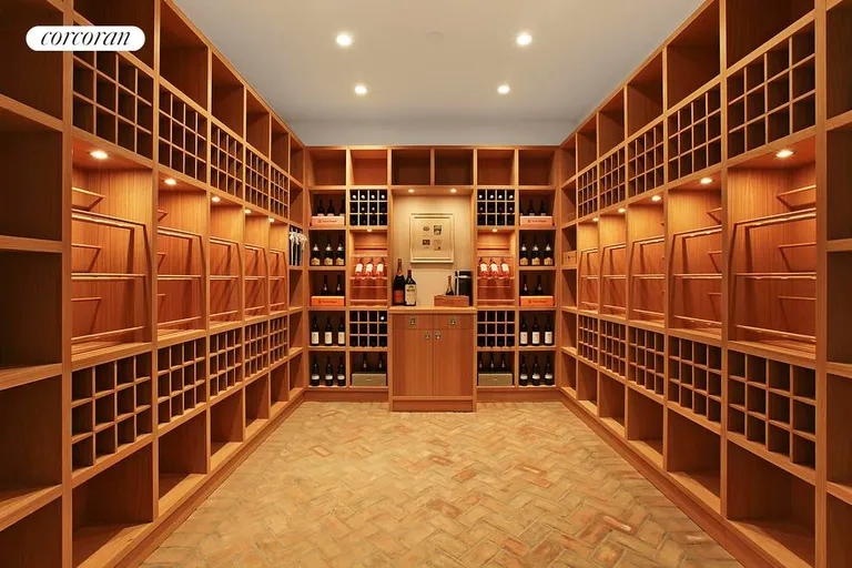 New York City Real Estate | View  | 1,200 bottle wine cellar and tasting room. Finished lower level also includes a professional grade screening room, fully equipped gym with sauna and kitchen, two ensuite bedrooms, kitchenette, full laundry room, and staff quarters. | View 23