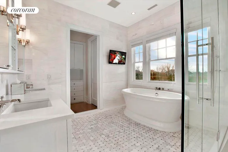 New York City Real Estate | View  | Master Bathroom with Radiant Heated Floor, Lefroy Brooks Fixtures, Marble Tiling, and Integrated Tub with TV | View 17