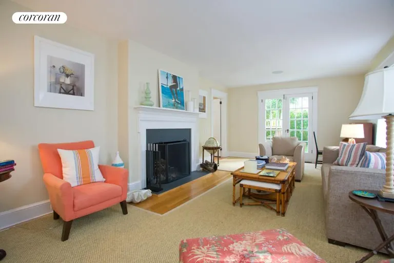 New York City Real Estate | View  | Sunny living room with french doors and fireplace | View 4