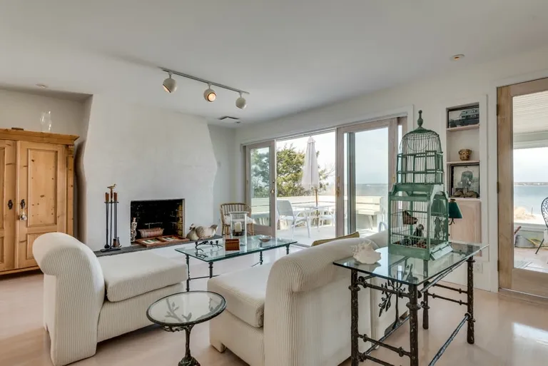 New York City Real Estate | View 392 Dune Road | 2-ended living room with fireplace | View 5