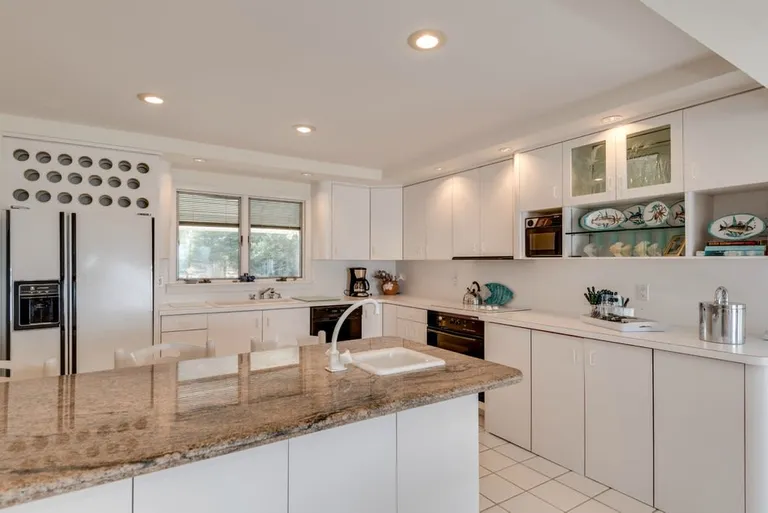 New York City Real Estate | View 392 Dune Road | granite counter with bar sink | View 8