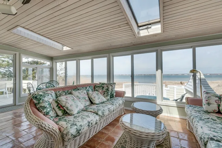 New York City Real Estate | View 392 Dune Road | family room with breakfast table | View 11