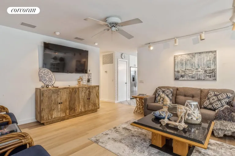 New York City Real Estate | View 34 Rolling Hill Court West | Den with Large Screen TV | View 10