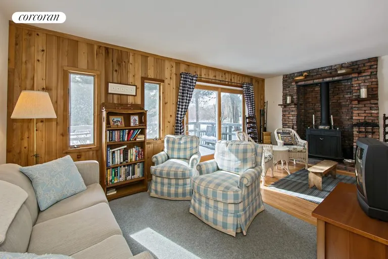 New York City Real Estate | View  | Living Room with Fireplace and Sliders to Front Deck | View 4