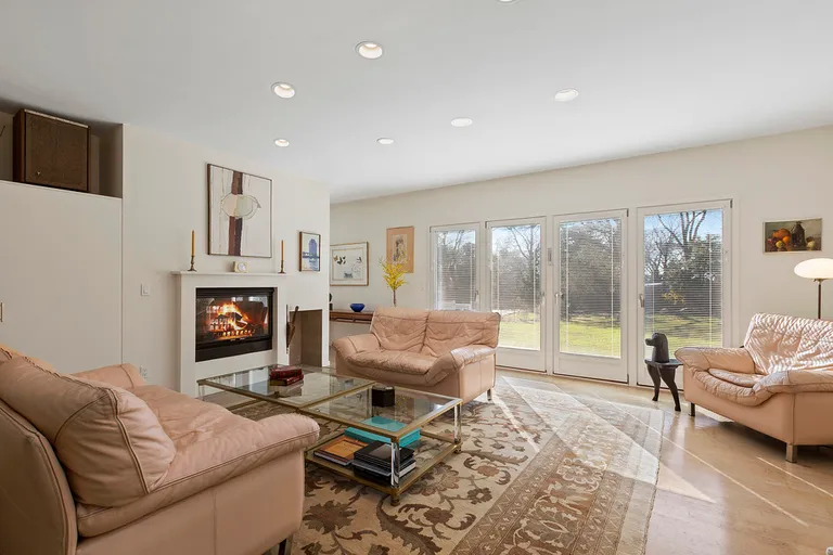 New York City Real Estate | View  | Living room with double sided fireplace | View 4