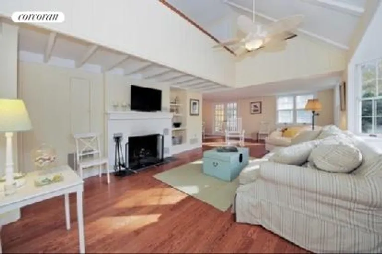 New York City Real Estate | View  | Double high ceilings in living room with fireplace | View 4