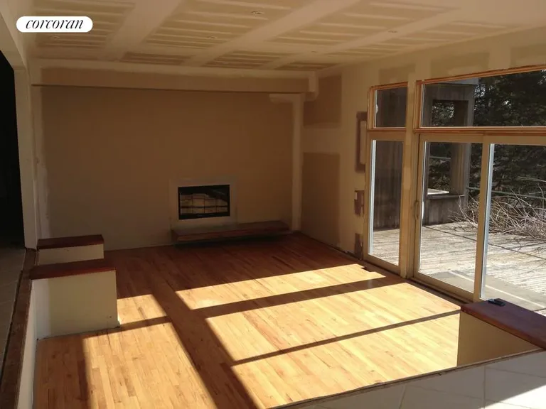 New York City Real Estate | View  | Great room w/Fireplace, doors lead to deck/water | View 10