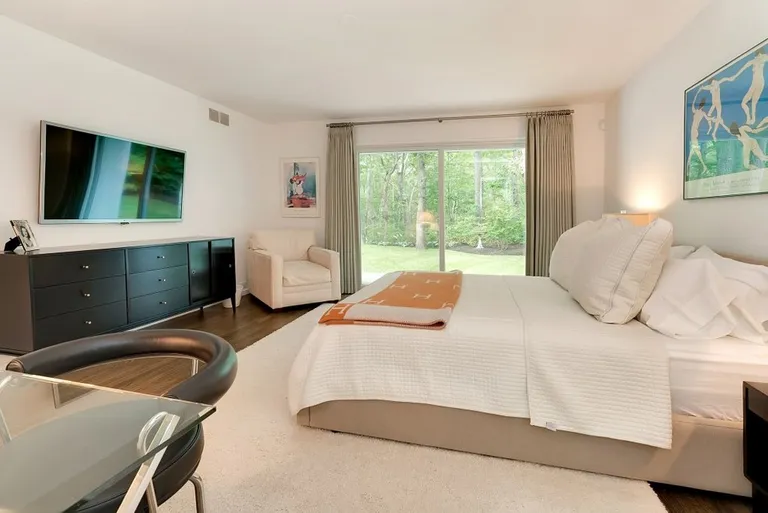 New York City Real Estate | View 27 North Hollow Drive | Master Bedroom Opening to Deck & Garden | View 10