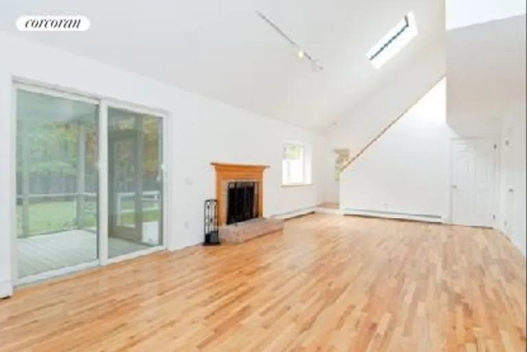 New York City Real Estate | View  | Wood burning fireplace and sliders to screened in porch | View 7