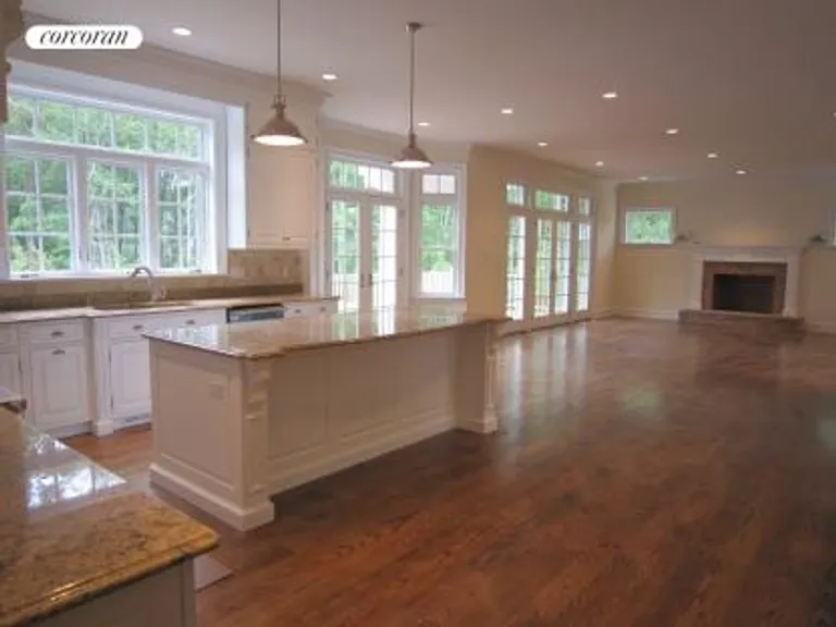 New York City Real Estate | View  | Open Floor Plan Kitchen and Great Room with Fireplace | View 7