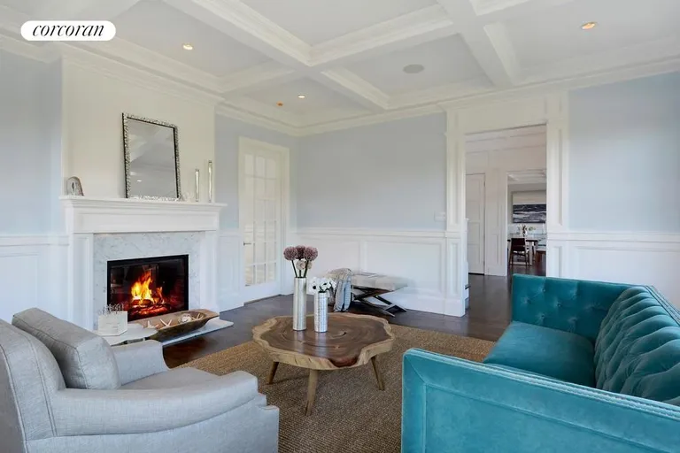 New York City Real Estate | View  | Living room with double sided fireplace (Den on the other side) | View 4