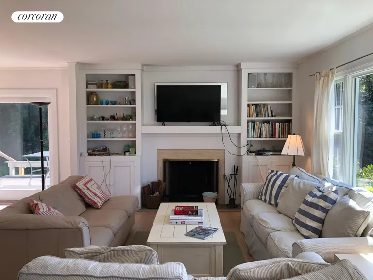New York City Real Estate | View 9 Sandpiper Lane | Living room with flat screen TV | View 8