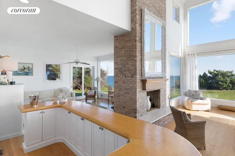 The Hamptons Real Estate | View 390 Old Montauk Highway | bar opens to mulit living spaces | View 11
