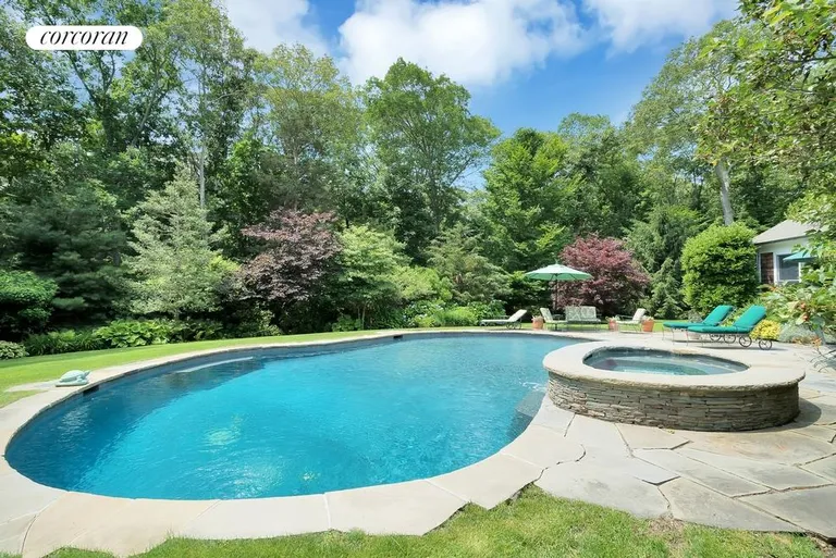New York City Real Estate | View 104 Old Stone Highway (House & Cottage) | The heated gunite pool is surrounded by ample stone decking for entertaining or relaxing | View 12