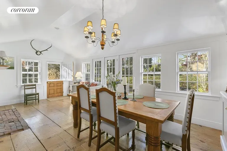New York City Real Estate | View  | Dining room with wall of French doors facing garden | View 7