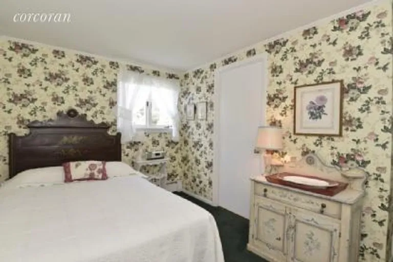 New York City Real Estate | View 16 Stevens Lane | Downstairs wing bedroom #1 | View 17