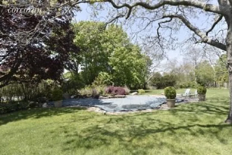 New York City Real Estate | View 16 Stevens Lane | pool and lawn | View 20