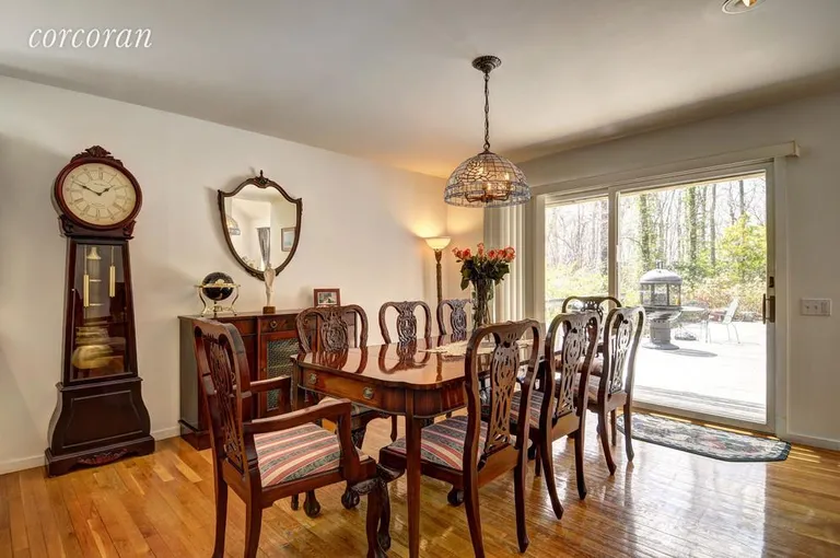 New York City Real Estate | View 55 Northside Drive | Dining Room with doors to deck and pool | View 6