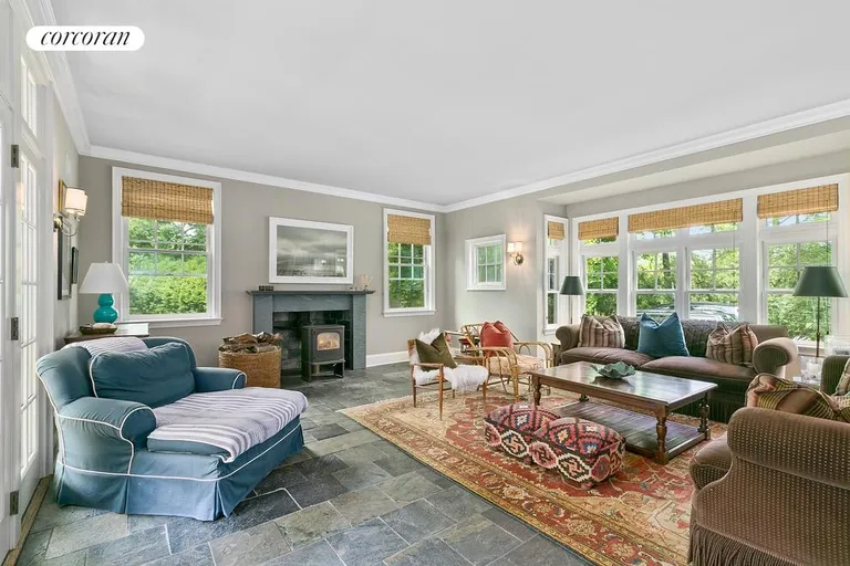 New York City Real Estate | View  | Great room with fireplace opens out to the covered porch an patio | View 6