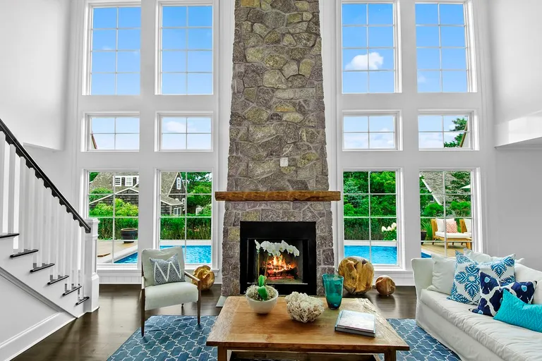 New York City Real Estate | View  | Wall of Windows with Stone Fireplace | View 8
