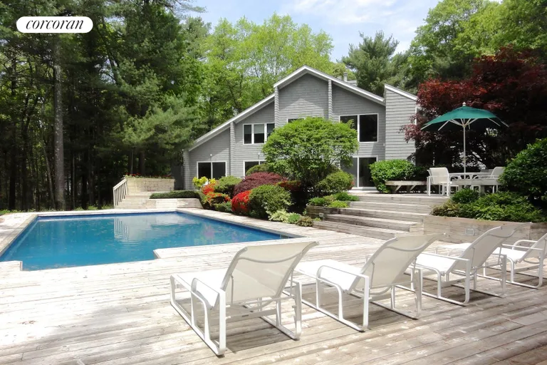 New York City Real Estate | View 36 Bull Path | Expansive decking surrounds the pool | View 2
