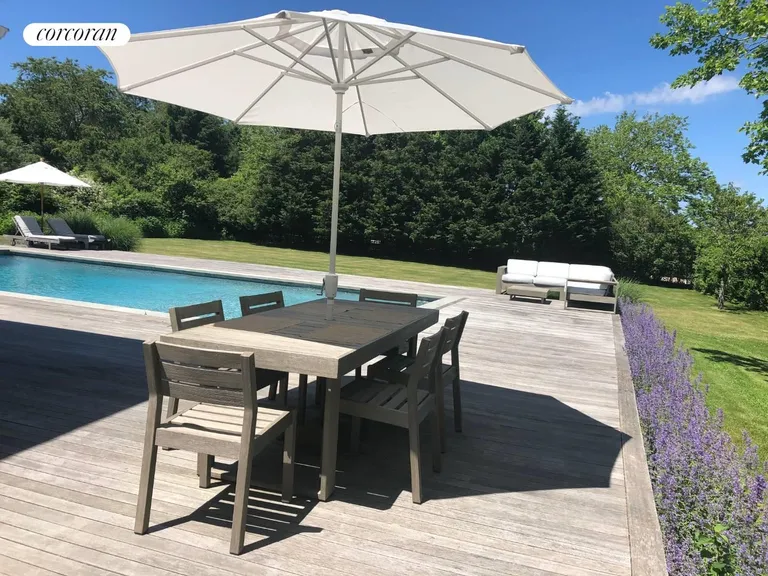 New York City Real Estate | View 761 North Sea Mecox Road | outdoor dining to pool | View 4