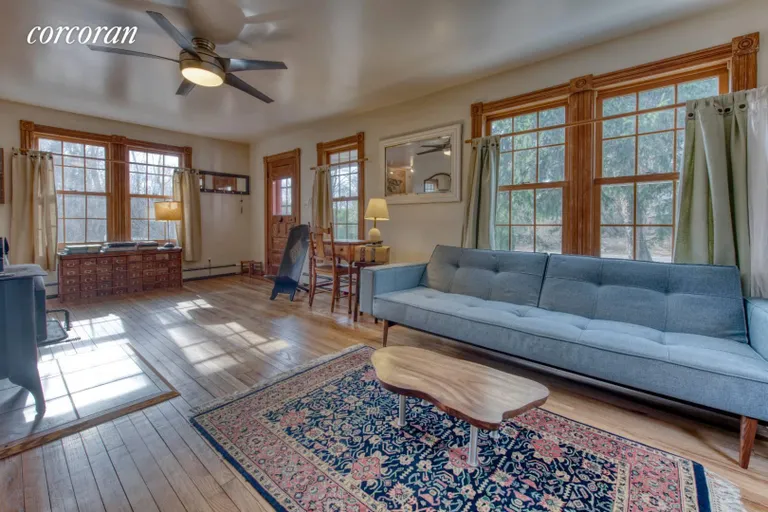 New York City Real Estate | View 54 North Cartwright Road | living room with wood stove | View 5