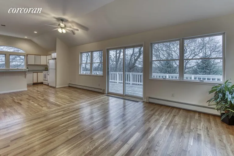 New York City Real Estate | View 25 North Fernwood | great room out to deck | View 8