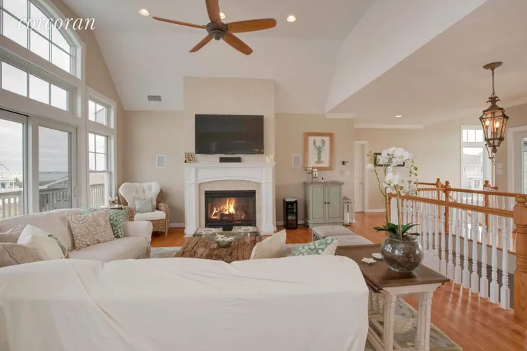 New York City Real Estate | View 812 Dune Road | Living Room with Fireplace | View 9