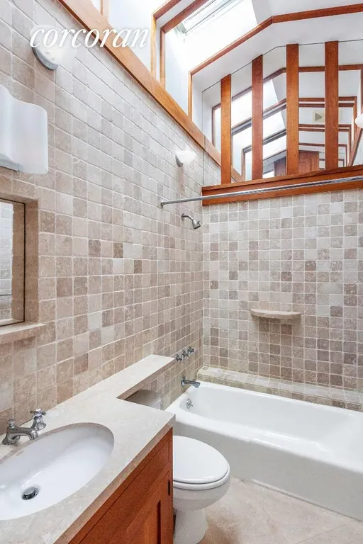 New York City Real Estate | View 132 South Country Road | Hall Bathroom | View 16