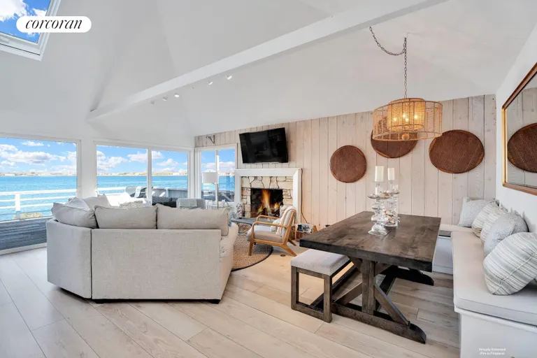 New York City Real Estate | View 56 Dune Road | Living Room-Fireplace Virtually Enhanced | View 2