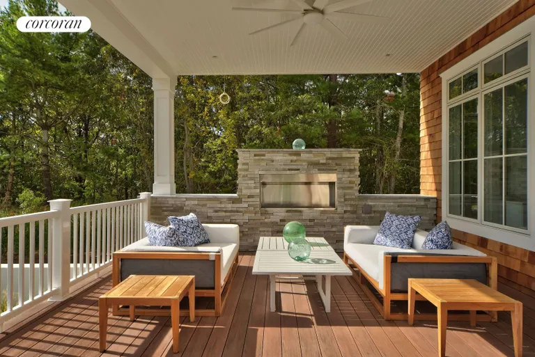 New York City Real Estate | View 12 Water Mill Heights Drive | covered porch with fireplace | View 28